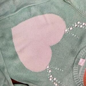 Features heart jeweled antlers and stylish blouse